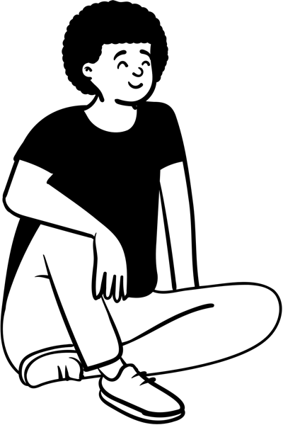 A person sitting cross-legged, smiling